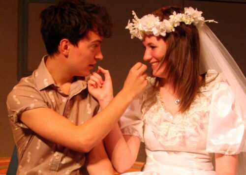 Benjamin and Elaine on their wedding night eating Cheerios