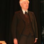 John Holmes As Merriman, The Butler