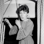 Jenni Rushton as Helga Philby escaping out of the window!
