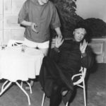 Keith Beattie as Nicholas taking orders from The Principal, John Skelton