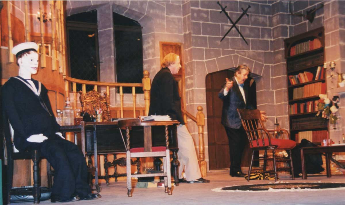 Geoff Hool as Andrew Wyke. with Dave Stockwin as Milo Tindle,