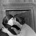 William (Ron Dickens) steals a kiss from Maggie (Barbara Singleton)