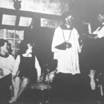 The VIcar in emergency attire asks the Rev. Humphrey (I. Mc C. Bell) to help him check his pools in the potting shed, watched by Willie D.A. Collins) and Ida