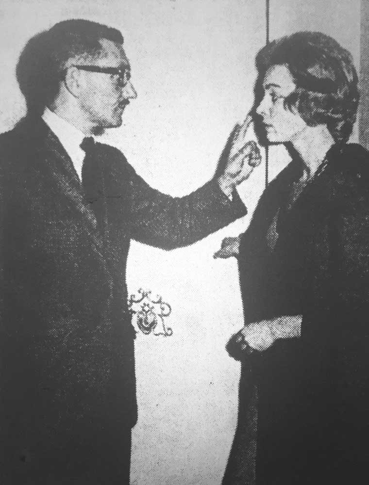 Howard Holt advises Julie Grant (Joan McClymont) not to say a word