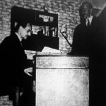 The Inspector (John Gale) checks Charles Norbury's (D.H. Evans) gun licence
